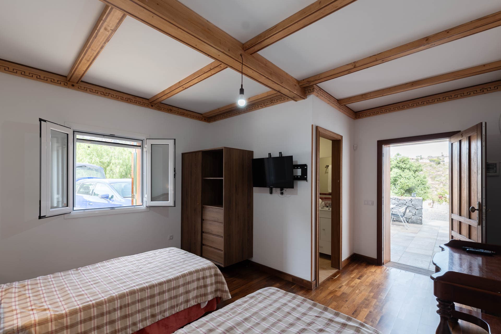 Dormitorio doble con baño en suite en Finca Anconito
